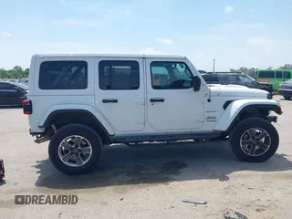 2018 Jeep Wrangler Unlimited Sahara z VIN 1C4HJXEG0JW245118, wystawiony jako IAAI lot #42066614 z przebiegiem 83 743 mil mil oraz . Historia ofert i sprzedaży dostępna na DreamBid. Obrazek 14.