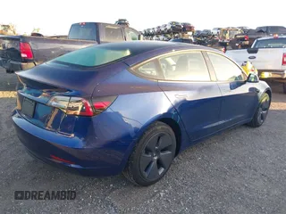2022 Tesla Model 3 with VIN 5YJ3E1EA3NF190553, listed as a IAAI auction lot 41760731 with 90,268 mi miles. Bid and sale history available at carsss.com. Image 4.