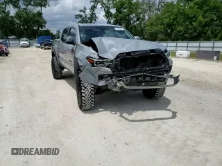 2020 Toyota Tacoma SR5 z VIN 3TMAZ5CN0LM115004, wystawiony jako Copart lot #55343295 z przebiegiem 82 865 mil mil oraz Nie do naprawy • Non repairable. Historia ofert i sprzedaży dostępna na DreamBid. Obrazek 14.