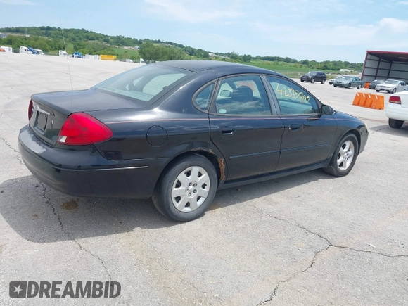 2003 Ford Taurus SE Standard with VIN 1FAFP53U13A102879, listed as a IAAI auction lot 42335795 with 193,023 mi miles and . Bid and sale history available at DreamBid. Image 4.