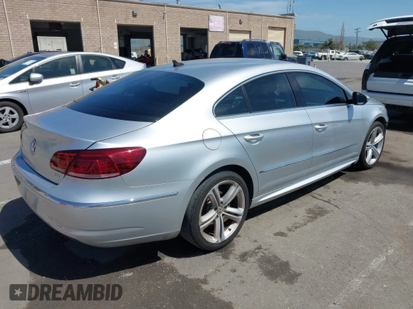 2014 Volkswagen CC R-Line with VIN WVWBP7AN0EE527649, listed as a IAAI auction lot 42009588 with 122,964 mi miles. Bid and sale history available at carsss.com. Image 4.