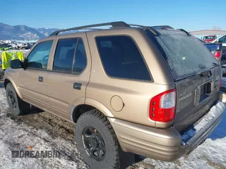2002 Isuzu Rodeo with VIN 4S2DM58W824320291, listed as a IAAI auction lot 41385761 with 177,441 mi miles. Bid and sale history available at carsss.com. Image 3.