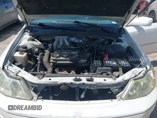 2001 Toyota Avalon XL z VIN 4T1BF28B91U183347, wystawiony jako IAAI lot #42441956 z przebiegiem 310 167 mil mil oraz . Historia ofert i sprzedaży dostępna na DreamBid. Obrazek 10.
