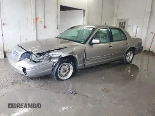 2001 Ford Crown Victoria LX z VIN 2FAFP74W51X127929, wystawiony jako Copart lot #44539965 z przebiegiem 210 229 mil mil oraz Szkoda całkowita • Salvage title. Historia ofert i sprzedaży dostępna na DreamBid. Obrazek 1.