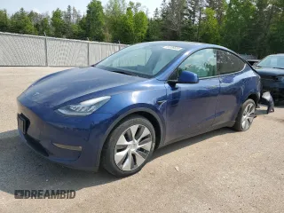2022 Tesla Model Y Long Range z VIN 7SAYGDEE7NF436897, wystawiony jako Copart lot #57336655 z przebiegiem 104 089 mil mil oraz Szkoda całkowita • Salvage title. Historia ofert i sprzedaży dostępna na DreamBid. Obrazek 1.