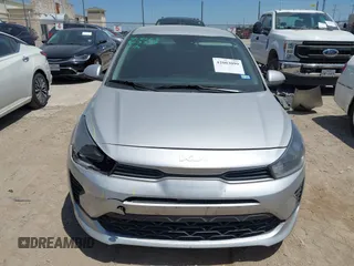 2023 Kia Rio S z VIN 3KPA24AD6PE600384, wystawiony jako IAAI lot #42003099 z przebiegiem 27 001 mil mil oraz . Historia ofert i sprzedaży dostępna na DreamBid. Obrazek 12.