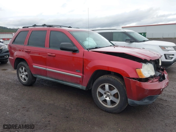 2009 Jeep Grand Cherokee Laredo with VIN 1J8GR48K99C549346, listed as a IAAI auction lot 41870627 with 170,949 mi miles. Bid and sale history available at carsss.com. Image 1.