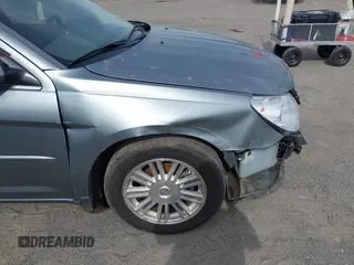 2007 Chrysler Sebring Touring z VIN 1C3LC56KX7N542931, wystawiony jako IAAI lot #42167913 z przebiegiem 240 638 mil mil oraz . Historia ofert i sprzedaży dostępna na DreamBid. Obrazek 13.