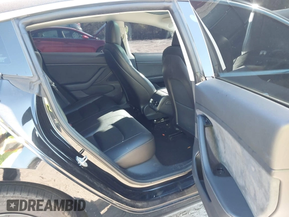 2019 Tesla Model 3 Mid Range with VIN 5YJ3E1EA2KF306286, listed as a IAAI auction lot 41699127 with 56,249 mi miles and . Bid and sale history available at DreamBid. Image 8.
