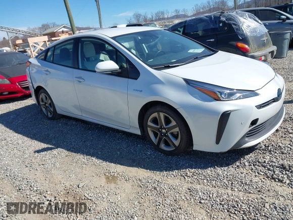2021 Toyota Prius L Eco z VIN JTDKAMFUXM3142402, wystawiony jako IAAI lot #41665484 z przebiegiem 67 416 mil mil oraz . Historia ofert i sprzedaży dostępna na DreamBid. Obrazek 1.