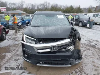 2021 Honda Pilot Touring 8-Passenger z VIN 5FNYF6H94MB091384, wystawiony jako IAAI lot #41567070 z przebiegiem 78 330 mil mil oraz . Historia ofert i sprzedaży dostępna na DreamBid. Obrazek 12.