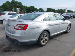 2015 Ford Taurus SEL z VIN 1FAHP2E88FG133328, wystawiony jako IAAI lot #42179649 z przebiegiem 127 171 mil mil oraz . Historia ofert i sprzedaży dostępna na DreamBid. Obrazek 4.