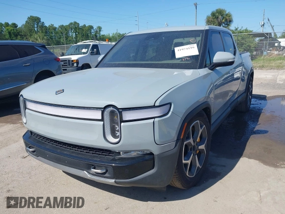 2022 Rivian R1T Adventure z VIN 7FCTGAAA2NN006053, wystawiony jako IAAI lot #41974199 z przebiegiem 286 mil mil oraz . Historia ofert i sprzedaży dostępna na DreamBid. Obrazek 2.