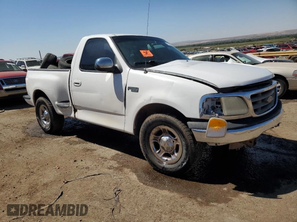 2000 Ford F-150 XL with VIN 1FTZF0727YKA84301, listed as a Copart auction lot 71593544 with 0 mi miles and Salvage Title. Bid and sale history available at carsss.com. Image 4.
