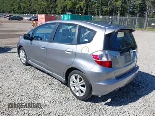 2009 Honda Fit Sport z VIN JHMGE88489S001452, wystawiony jako IAAI lot #42316783 z przebiegiem 129 856 mil mil oraz . Historia ofert i sprzedaży dostępna na DreamBid. Obrazek 3.