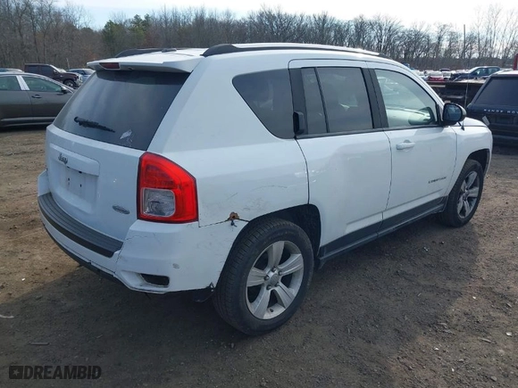 2012 Jeep Compass Latitude with VIN 1C4NJDEB5CD584509, listed as a IAAI auction lot 41672784 with 166,271 mi miles. Bid and sale history available at carsss.com. Image 4.