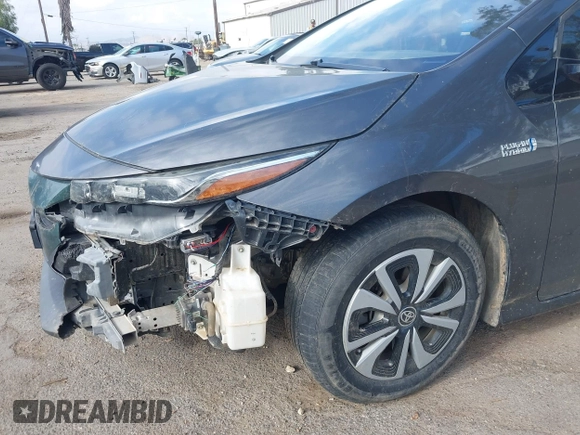 2018 Toyota Prius Plus with VIN JTDKARFPXJ3104302, listed as a IAAI auction lot 42127312 with 87,531 mi miles and . Bid and sale history available at DreamBid. Image 6.