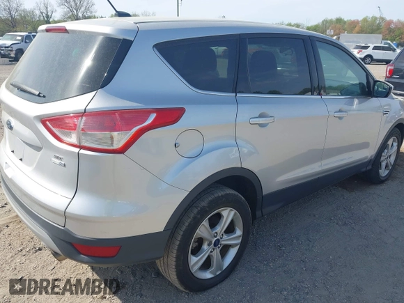 2015 Ford Escape SE with VIN 1FMCU9GX9FUC19545, listed as a IAAI auction lot 42128800 with 157,506 mi miles. Bid and sale history available at carsss.com. Image 4.