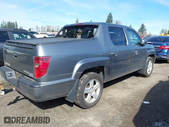 2009 Honda Ridgeline RTL with VIN 5FPYK16599B100707, listed as a IAAI auction lot 41877598 with 130,622 mi miles and . Bid and sale history available at DreamBid. Image 4.