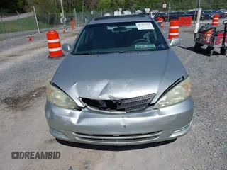 2004 Toyota Camry LE with VIN 4T1BE30K14U290983, listed as a IAAI auction lot 41983078 with 174,852 mi miles and . Bid and sale history available at carsss.com. Image 6.