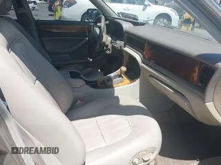 1997 Jaguar XJ with VIN SAJHX1243VC811674, listed as a IAAI auction lot 42333801 with 213,248 mi miles and . Bid and sale history available at DreamBid. Image 5.