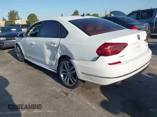 2018 Volkswagen Passat 2.0T S with VIN 1VWAA7A35JC009020, listed as a IAAI auction lot 41955626 with 99,900 mi miles. Bid and sale history available at carsss.com. Image 3.