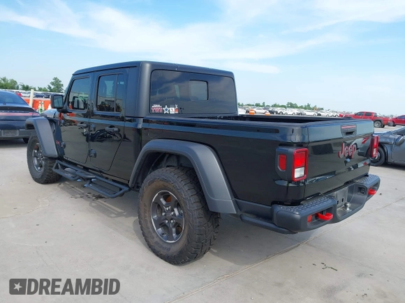 2021 Jeep Gladiator Rubicon z VIN 1C6JJTBG6ML535939, wystawiony jako IAAI lot #42260764 z przebiegiem 114 060 mil mil oraz . Historia ofert i sprzedaży dostępna na DreamBid. Obrazek 3.