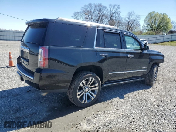 2015 GMC Yukon Denali with VIN 1GKS2CKJ5FR612147, listed as a Copart auction lot 49209525 with 127,262 mi miles and Salvage Title. Bid and sale history available at carsss.com. Image 3.