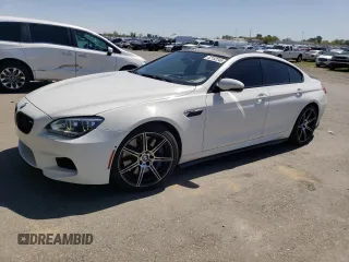 2015 BMW M6 z VIN WBS6C9C50FD467538, wystawiony jako Copart lot #52152245 z przebiegiem 65 483 mil mil oraz Czysty tytuł • Clean title. Historia ofert i sprzedaży dostępna na DreamBid. Obrazek 1.