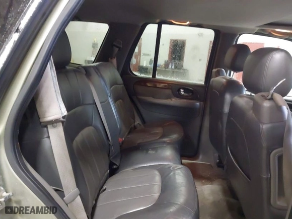2004 GMC Envoy SLE with VIN 1GKDT13S842295715, listed as a IAAI auction lot 41602246 with 162,119 mi miles. Bid and sale history available at carsss.com. Image 8.