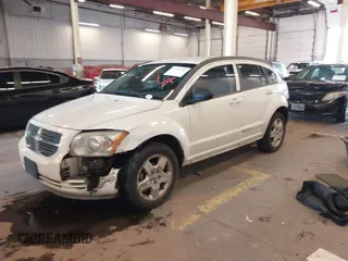 2009 Dodge Caliber SXT with VIN 1B3HB48A89D116734, listed as a IAAI auction lot 41959281 with 209,136 mi miles and . Bid and sale history available at DreamBid. Image 18.