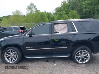 2016 GMC Yukon Denali with VIN 1GKS1CKJXGR254306, listed as a IAAI auction lot 39953539 with 164,149 mi miles. Bid and sale history available at carsss.com. Image 14.