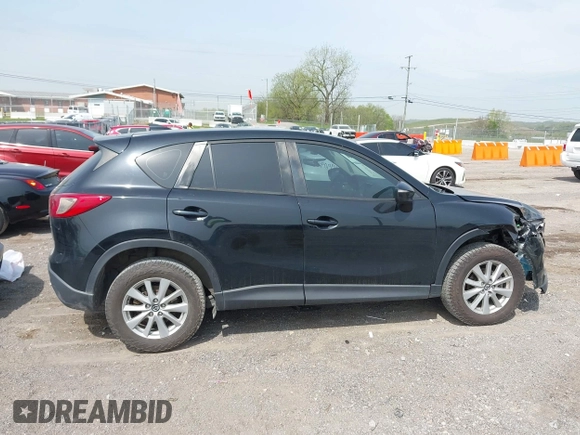 2016 Mazda CX-5 Sport with VIN JM3KE4BY8G0746377, listed as a IAAI auction lot 41990988 with 144,558 mi miles and . Bid and sale history available at carsss.com. Image 13.