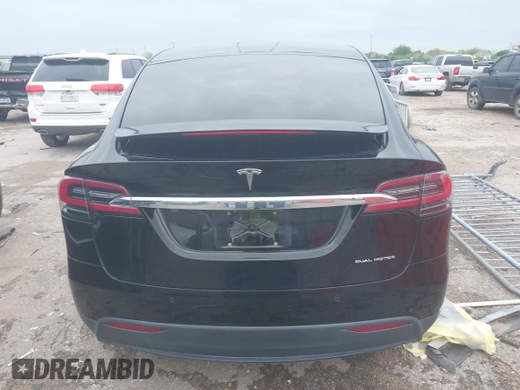 2021 Tesla Model X Long Range Plus with VIN 5YJXCAE27MF324270, listed as a IAAI auction lot 41886101 with 59,614 mi miles and . Bid and sale history available at carsss.com. Image 16.