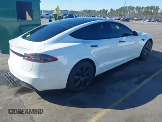 2021 Tesla Model S Long Range with VIN 5YJSA1E56MF453711, listed as a IAAI auction lot 41467603 with 115,634 mi miles and . Bid and sale history available at DreamBid. Image 4.