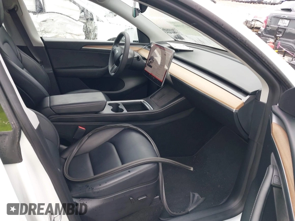 2023 Tesla Model Y Performance with VIN 7SAYGDEF7PF807312, listed as a IAAI auction lot 41711068 with 25,029 mi miles and . Bid and sale history available at DreamBid. Image 5.