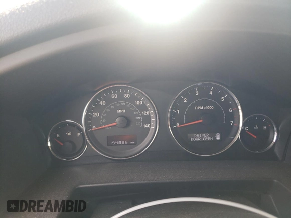 2009 Jeep Commander Sport z VIN 1J8HG48K39C554570, wystawiony jako Copart lot #52667825 z przebiegiem 194 886 mil mil oraz Szkoda całkowita • Salvage title. Historia ofert i sprzedaży dostępna na DreamBid. Obrazek 9.