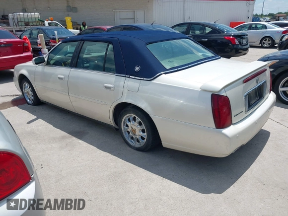 2002 Cadillac DeVille z VIN 1G6KD54Y42U206950, wystawiony jako IAAI lot #42189419 z przebiegiem 98 150 mil mil oraz . Historia ofert i sprzedaży dostępna na DreamBid. Obrazek 3.