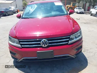 2018 Volkswagen Tiguan S with VIN 3VV1B7AX4JM043324, listed as a IAAI auction lot 42623550 with 62,858 mi miles and . Bid and sale history available at DreamBid. Image 12.