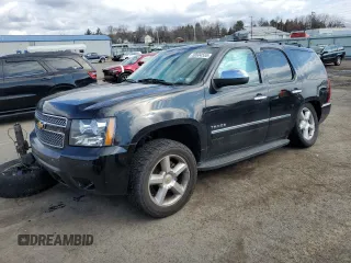2012 Chevrolet Tahoe LTZ with VIN 1GNSKCE08CR322969, listed as a Copart auction lot 50604555 with 165,190 mi miles and Salvage title. Bid and sale history available at DreamBid. Image 1.