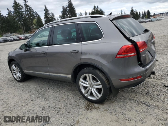 2012 Volkswagen Touareg Sport with VIN WVGFK9BP4CD001860, listed as a Copart auction lot 55090375 with 153,456 mi miles and Salvage title. Bid and sale history available at DreamBid. Image 2.