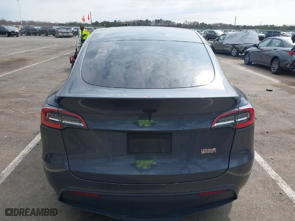 2021 Tesla Model Y Standard Range with VIN 5YJYGDED2MF118205, listed as a IAAI auction lot 41785040 with 63,628 mi miles. Bid and sale history available at carsss.com. Image 16.