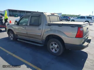 2004 Ford Explorer Sport Trac XLS with VIN 1FMZU67K24UA66100, listed as a IAAI auction lot 42035953 with 217,105 mi miles. Bid and sale history available at carsss.com. Image 3.