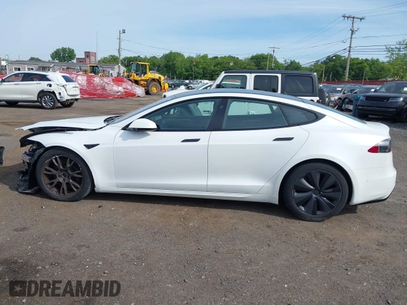 2022 Tesla Model S with VIN 5YJSA1E58NF467644, listed as a IAAI auction lot 42344403 with 52,628 mi miles and . Bid and sale history available at DreamBid. Image 14.