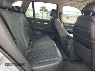 2015 BMW X5 xDrive50i with VIN 5UXKR6C51F0J74160, listed as a Copart auction lot 79337044 with 143,436 mi miles and Salvage title. Bid and sale history available at DreamBid. Image 12.