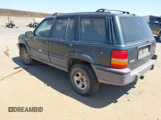 1994 Jeep Grand Cherokee Laredo with VIN 1J4GZ58S2RC118502, listed as a IAAI auction lot 42701778 with 420,559 mi miles and . Bid and sale history available at DreamBid. Image 3.