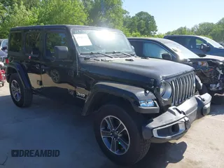 2023 Jeep Wrangler Sahara with VIN 1C4HJXEN5PW702268, listed as a IAAI auction lot 42288704 with 57,240 mi miles and . Bid and sale history available at DreamBid. Image 1.