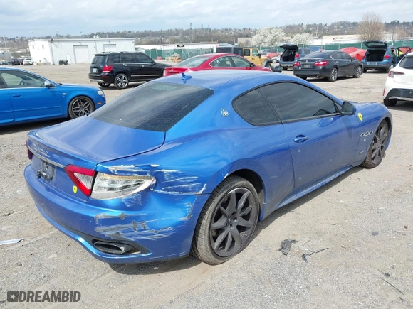 2013 Maserati GranTurismo Sport with VIN ZAM45VLA7D0073503, listed as a IAAI auction lot 41921102 with 53,436 mi miles. Bid and sale history available at carsss.com. Image 4.