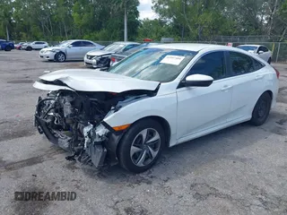 2020 Honda Civic LX z VIN 2HGFC2F65LH531818, wystawiony jako IAAI lot #41997104 z przebiegiem 68 878 mil mil oraz . Historia ofert i sprzedaży dostępna na DreamBid. Obrazek 2.