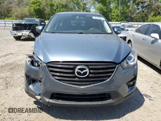 2016 Mazda CX-5 Touring with VIN JM3KE2CY0G0894283, listed as a Copart auction lot 50592065 with 86,400 mi miles and Salvage Title. Bid and sale history available at carsss.com. Image 5.